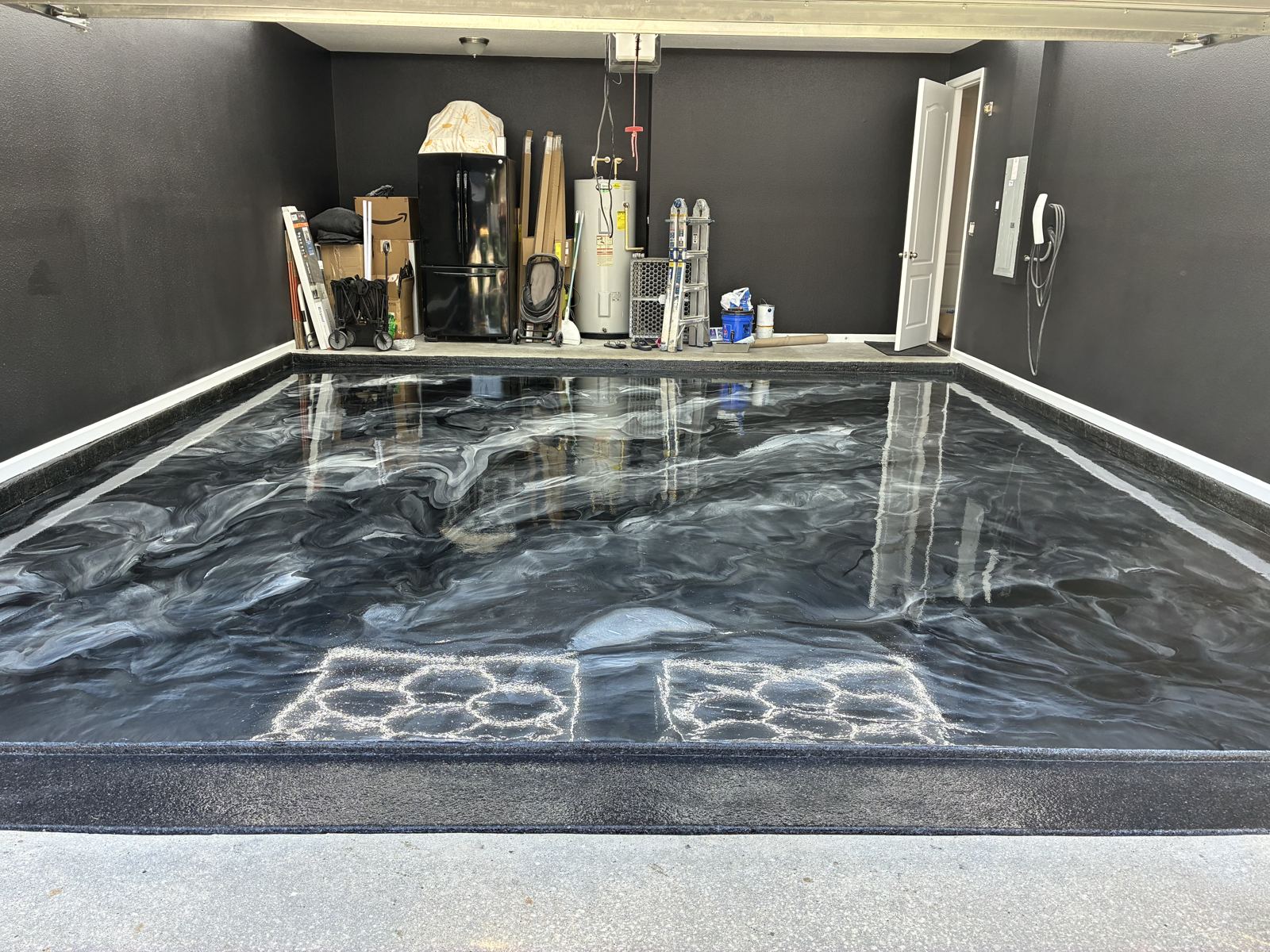 Silver and black metallic garage floor with border stripes